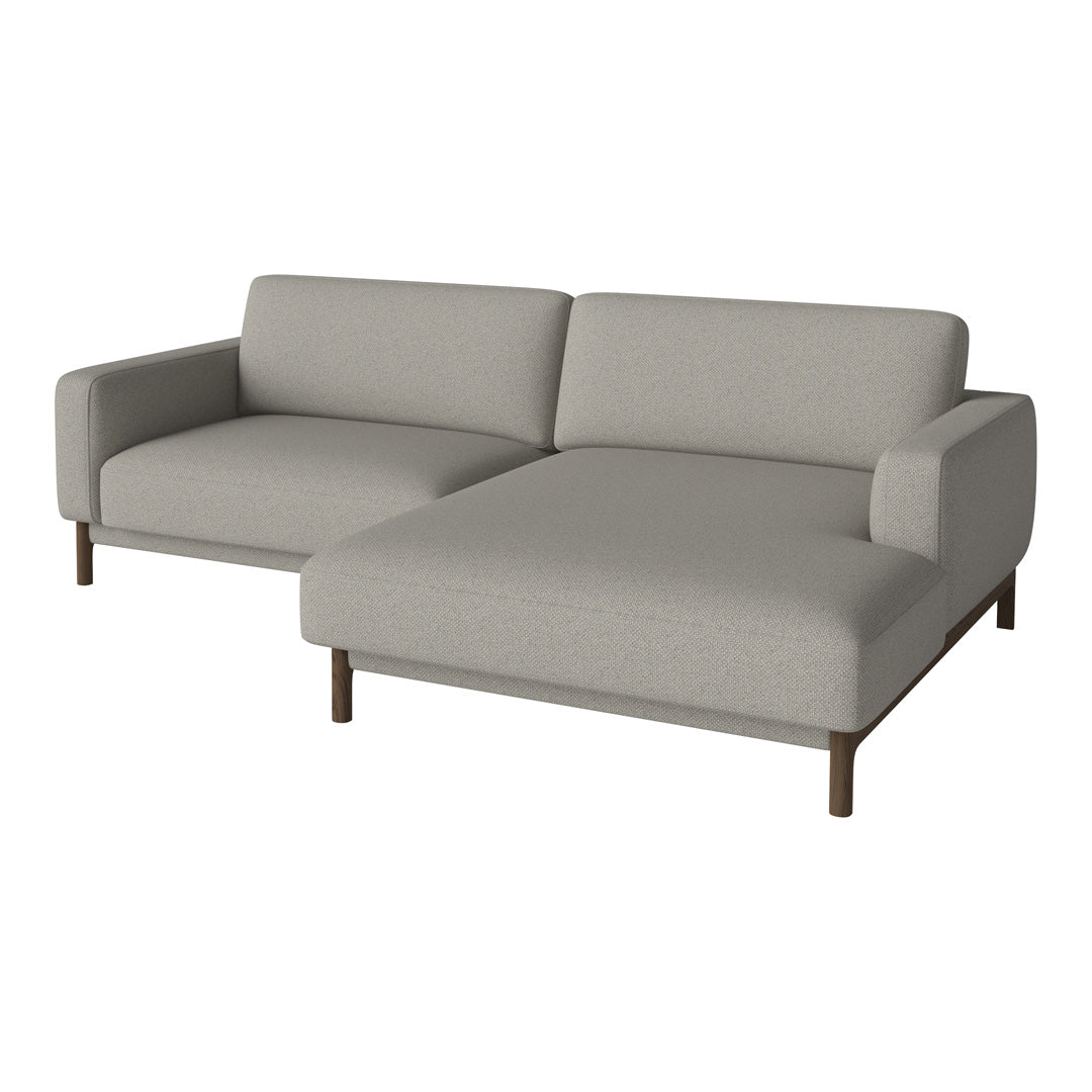 Light gray sectional sofa with minimalist design and smooth fabric, featuring clean lines and wooden legs.