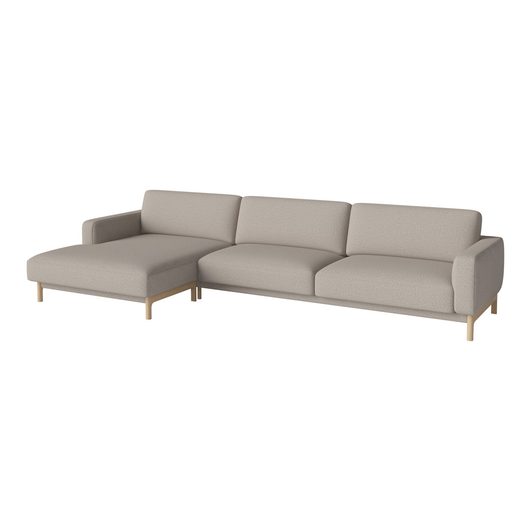 Light gray modern sectional sofa with clean lines and minimalist design, featuring soft, fabric upholstery and wooden legs.