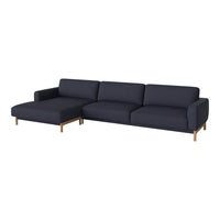 Navy blue sectional sofa with a modern design and solid wooden legs, perfect for stylish living spaces.