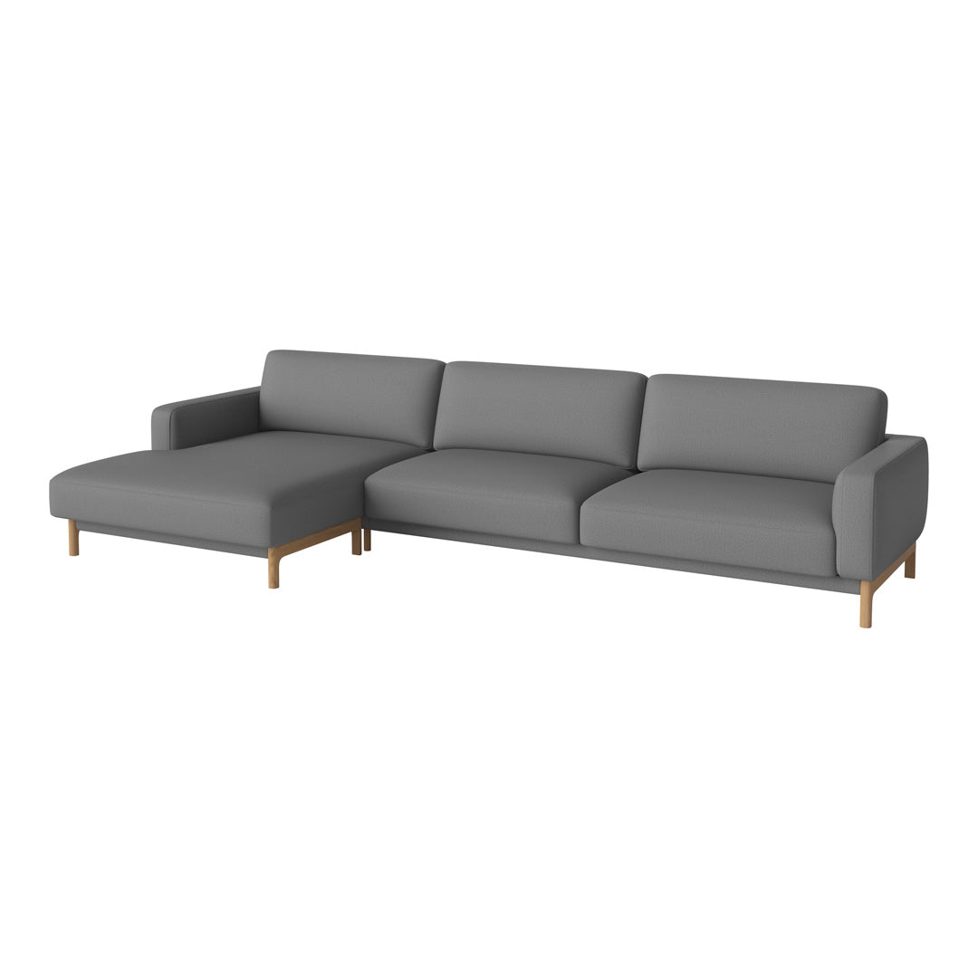 Gray sectional sofa with a minimalist design and solid wood legs, featuring smooth upholstery and a modern aesthetic.