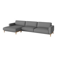 Gray sectional sofa with a minimalist design and solid wood legs, featuring smooth upholstery and a modern aesthetic.