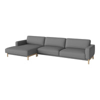 Modern grey sectional sofa with clean lines and wooden legs, featuring a sleek, minimalist design. Perfect for any decor.