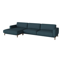 Teal sectional sofa with a contemporary design and smooth fabric, featuring a minimalistic silhouette.