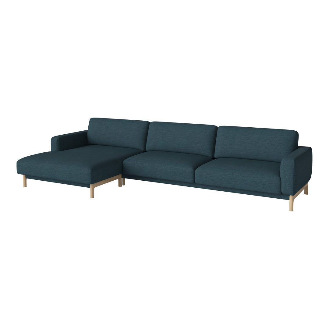 Teal upholstered sectional sofa with a modern design and gold legs, featuring a solid, textured fabric.