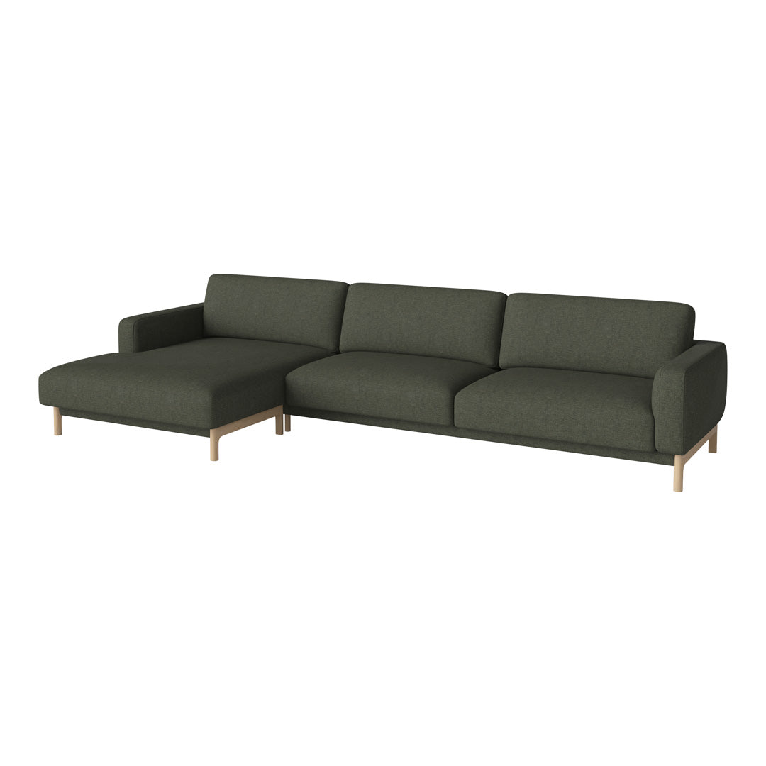 Modern dark green sectional sofa with clean lines and neutral wood legs. Perfect for stylish living spaces.