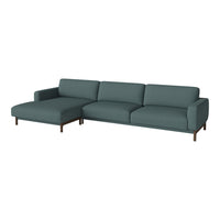 Teal fabric sectional sofa with clean lines and wooden legs, perfect for modern living spaces.