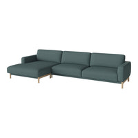Chic teal sectional sofa with a minimalist design and smooth fabric, complemented by sleek wooden legs.