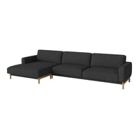 Modern dark gray sectional sofa with clean lines and a sleek wooden base, perfect for contemporary decor.