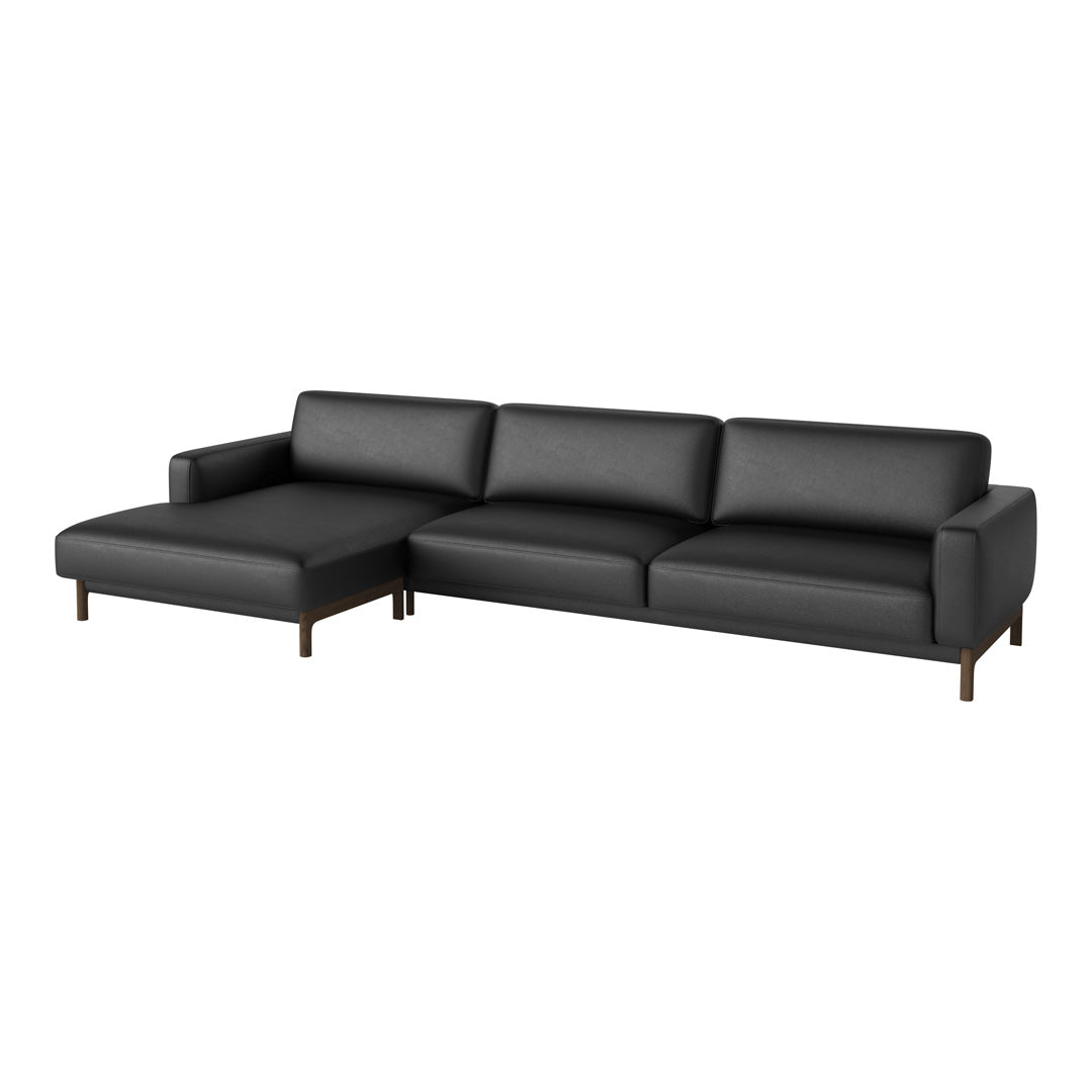 Modern black sectional sofa with smooth upholstery and minimalist wood legs, perfect for contemporary interiors.