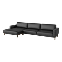 Modern black sectional sofa with smooth upholstery and minimalist wood legs, perfect for contemporary interiors.