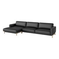 Black leather sectional sofa with sleek design and minimalist gold legs, perfect for modern interiors.
