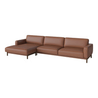 Brown leather sectional sofa with a sleek, modern design and minimalist aesthetic. Soft, smooth finish and structured lines.