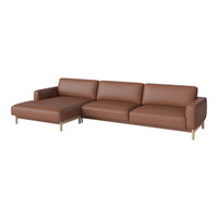 Brown leather sectional sofa with smooth texture and minimalist design, highlighting a warm, contemporary style.