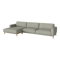Modern light gray sectional sofa with clean lines and minimalist design, featuring soft fabric and wooden legs.