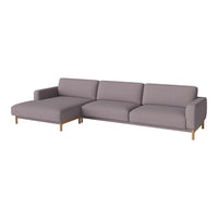 Modern sectional sofa in soft grey fabric with smooth lines and light wooden legs. Perfect for contemporary living spaces.