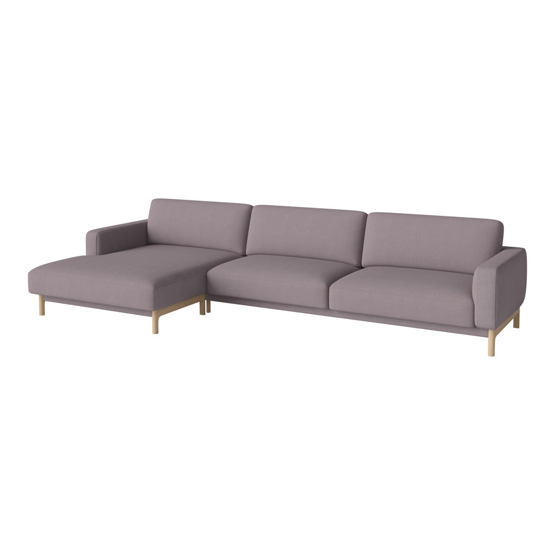 Light lavender sectional sofa with sleek, minimalist design and gold metal legs, perfect for modern decor.