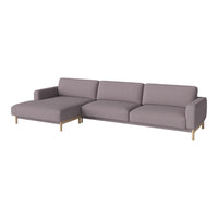 Light lavender sectional sofa with sleek, minimalist design and gold metal legs, perfect for modern decor.