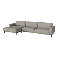 Light gray sectional sofa with minimalist design and smooth, solid fabric upholstery. Modern style with wood legs.