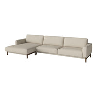 Beige fabric sectional sofa with clean lines and minimalist design, featuring subtle texture and dark wooden legs.