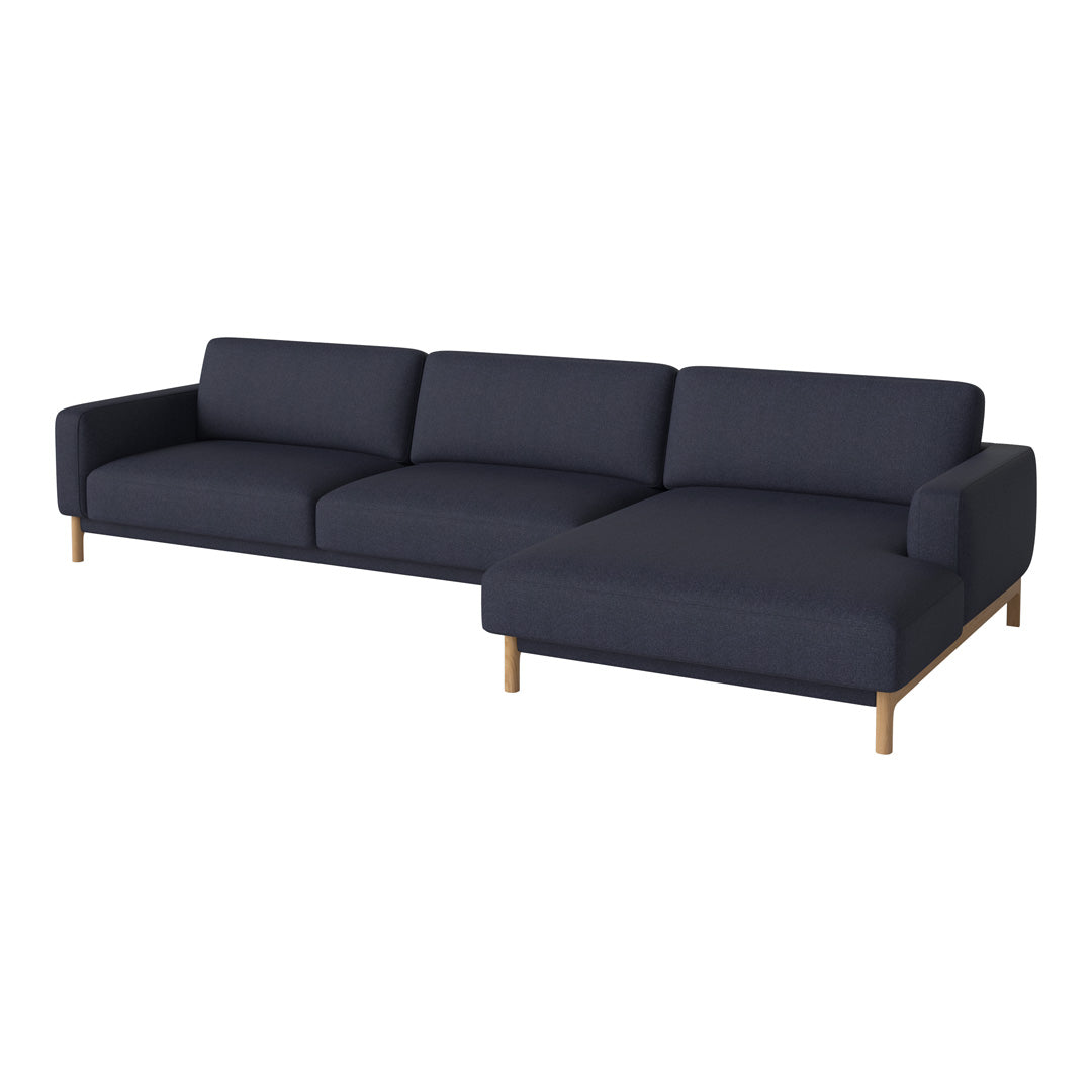 Modern navy blue sectional sofa with clean lines and wooden legs, perfect for contemporary living spaces.
