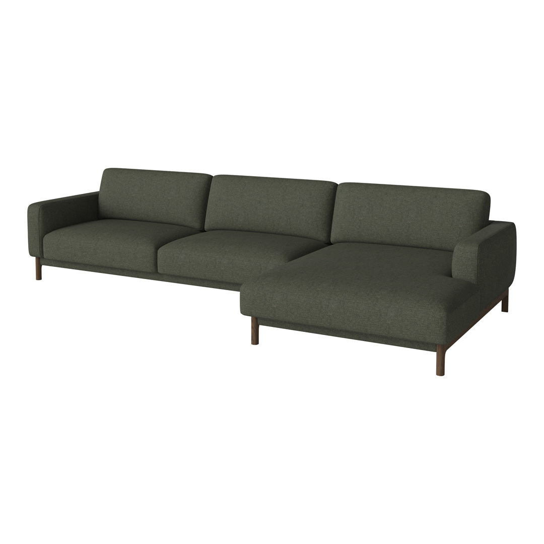 Modern dark green sectional sofa with clean lines and a minimalist design, featuring soft textured upholstery.