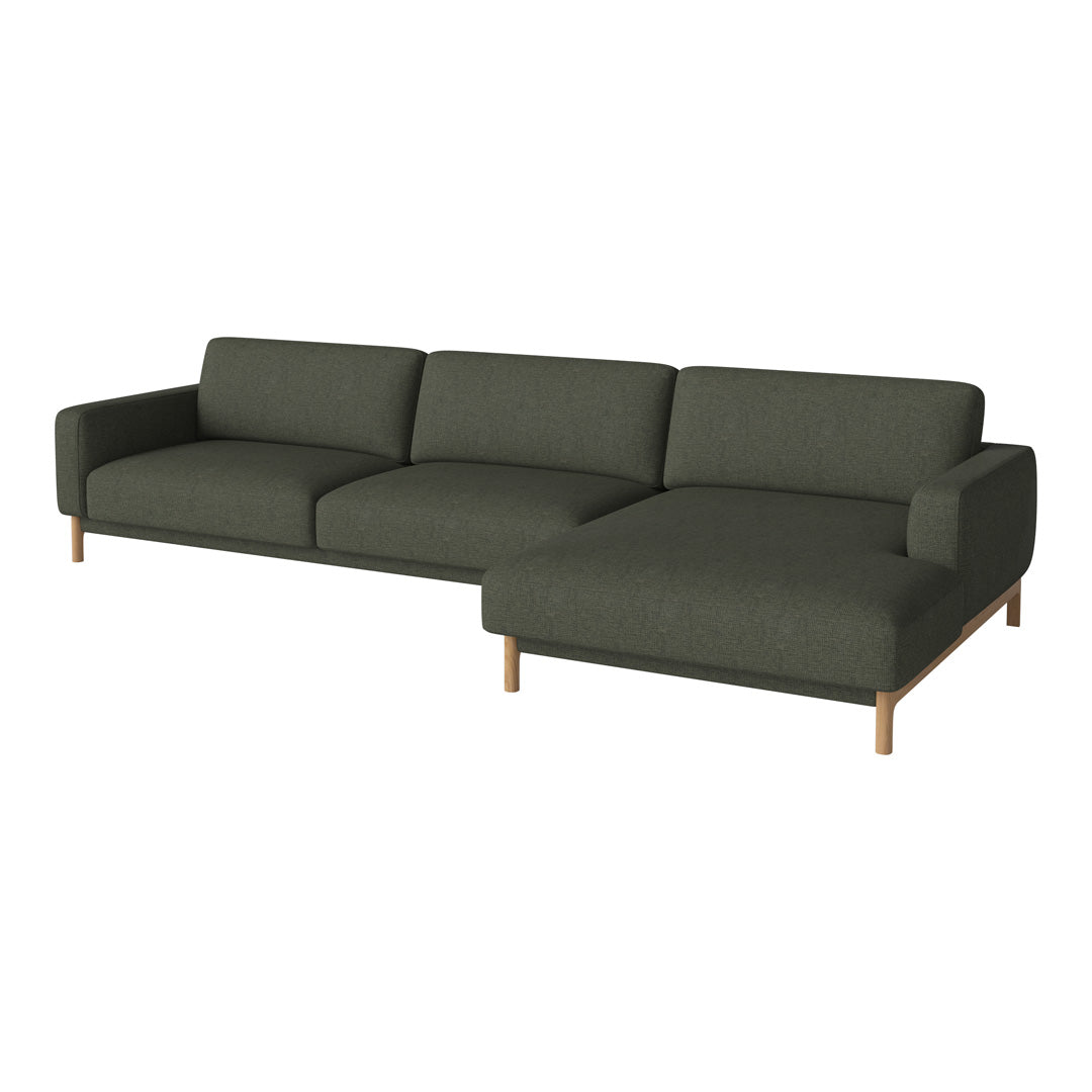 "Modern green fabric sectional sofa with wooden legs and a clean, minimalist design."