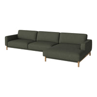 "Modern green fabric sectional sofa with wooden legs and a clean, minimalist design."