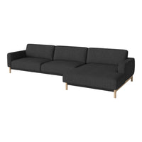 Modern dark gray sectional sofa with clean lines and subtle texture, featuring light wood legs for a stylish contrast.