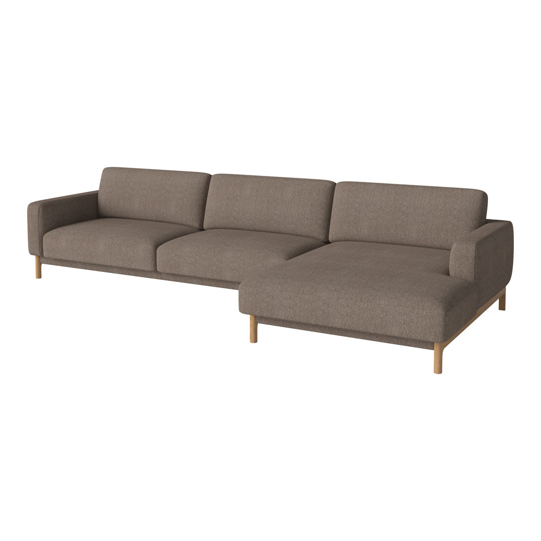 Light brown sectional sofa with a smooth texture and clean lines, featuring wooden legs for a modern touch.
