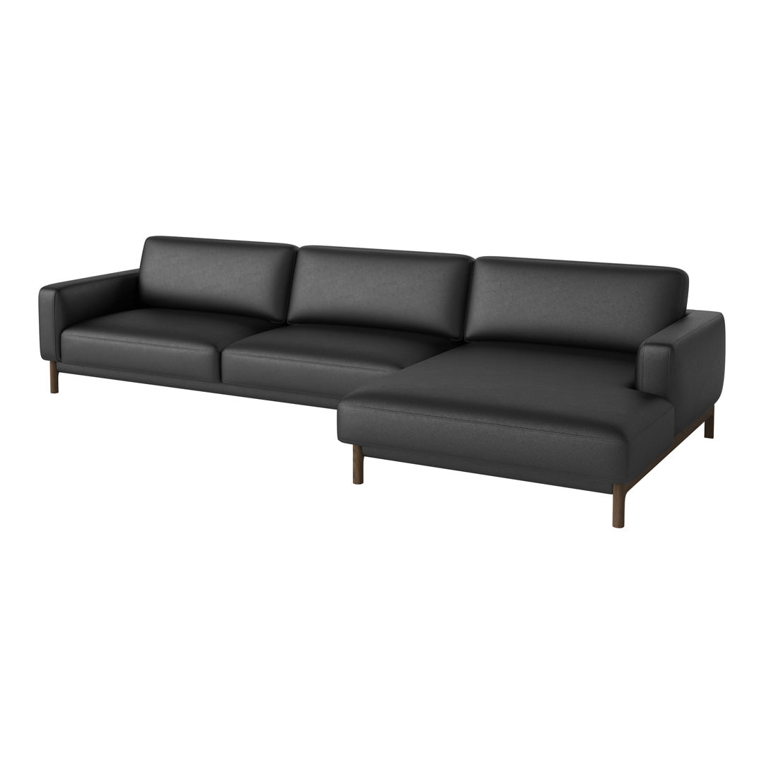 Modern black leather sectional sofa with clean lines and minimalist design, featuring a smooth, sleek finish.