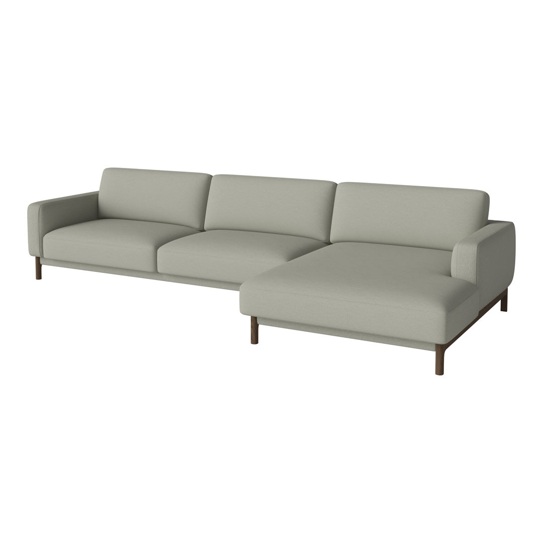 Light gray sectional sofa with clean lines and smooth upholstery, featuring a minimalist design and wooden legs.