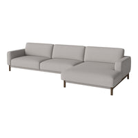 Light gray sectional sofa with a minimalist design and smooth fabric upholstery, featuring no distinct patterns.