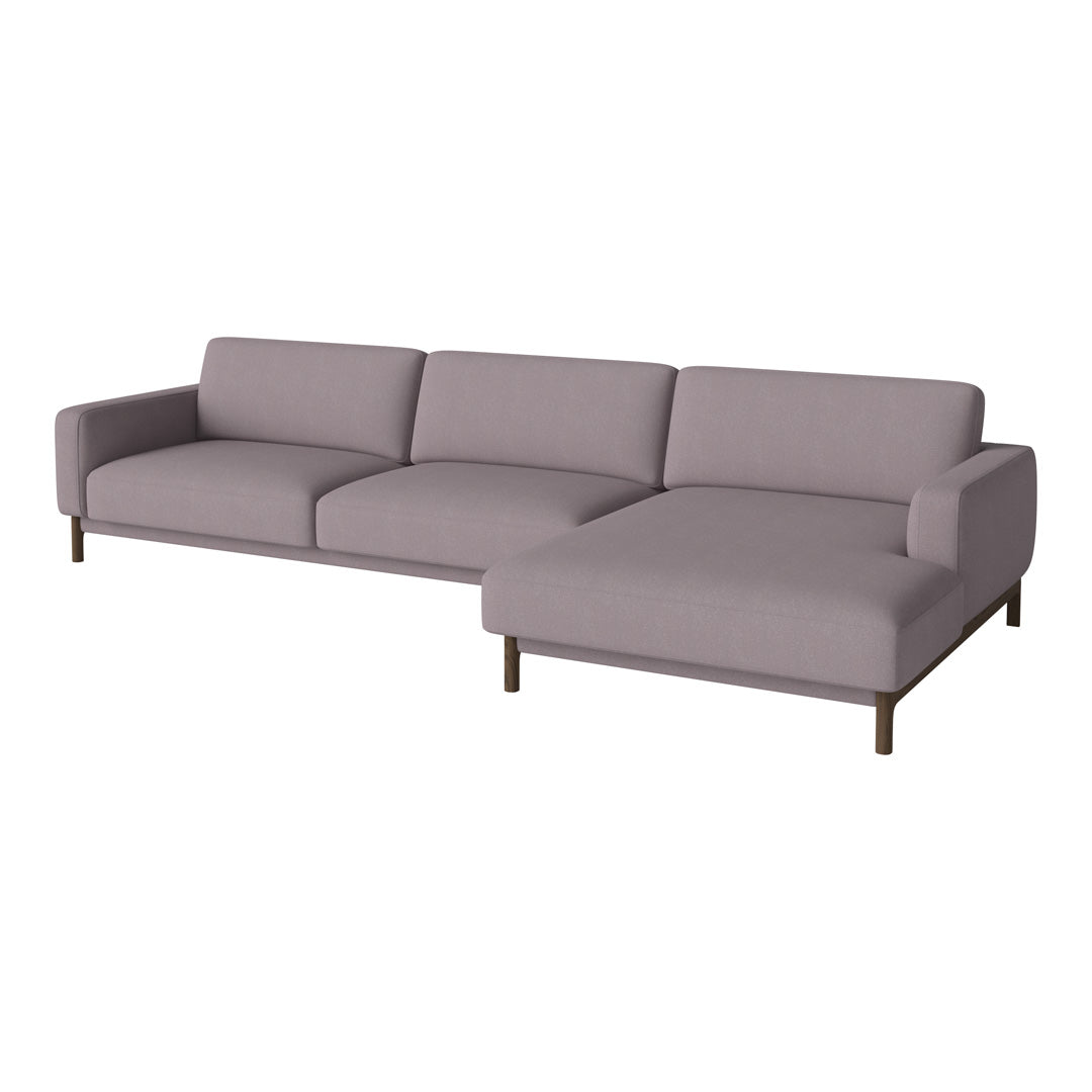 Modern L-shaped sofa in soft grey fabric with sleek wood legs, perfect for contemporary living spaces.