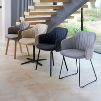 Stylish chairs in beige, grey, and black with ribbed patterns, arranged in a modern interior setting.