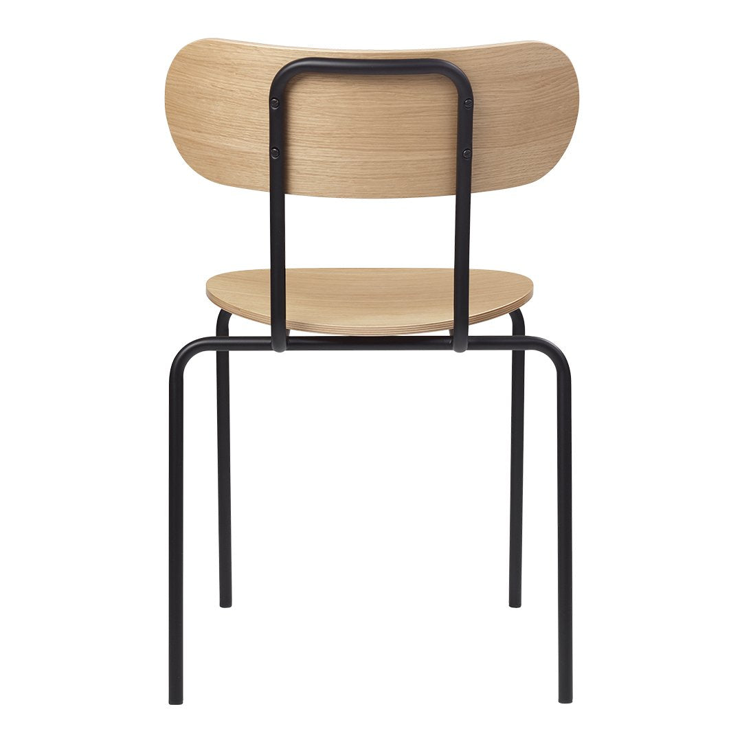 Back view of a minimalist chair featuring a natural wood finish and a sleek black metal frame.