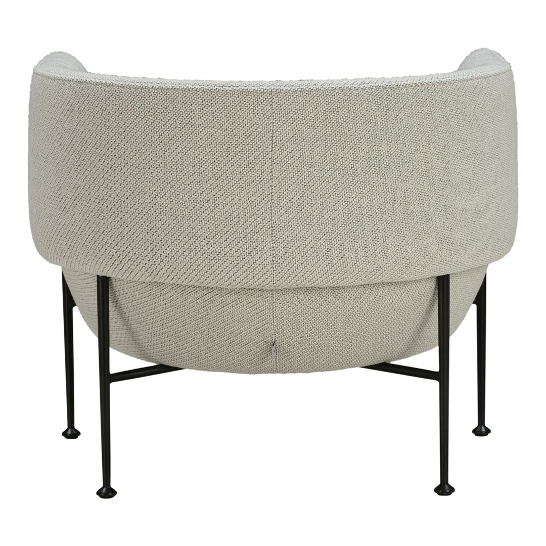 Cream textured fabric chair with curved shape and black metal legs, showcasing a modern minimalist design.