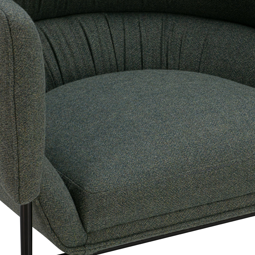 Green textured fabric armchair with pleated detailing and black metal legs. Modern, stylish, and comfortable design.