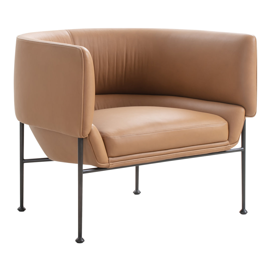 Tan leather accent chair with smooth, modern design and black metal legs, perfect for contemporary interiors.