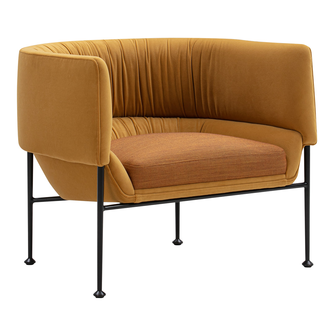 Velvet accent chair in mustard yellow and warm brown hues, featuring a smooth, pleated texture and sleek black legs.