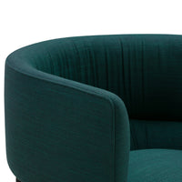 Luxurious dark teal fabric armchair with a smooth, textured finish and sleek curved design. Perfect for modern decor.