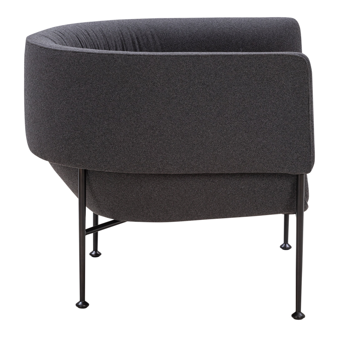 Dark gray upholstered chair with a sleek, curved silhouette and black metal legs, perfect for modern decor.