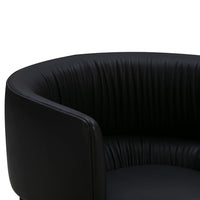 Black faux leather chair with ribbed texture and rounded design. Elegant and modern aesthetic for any space.