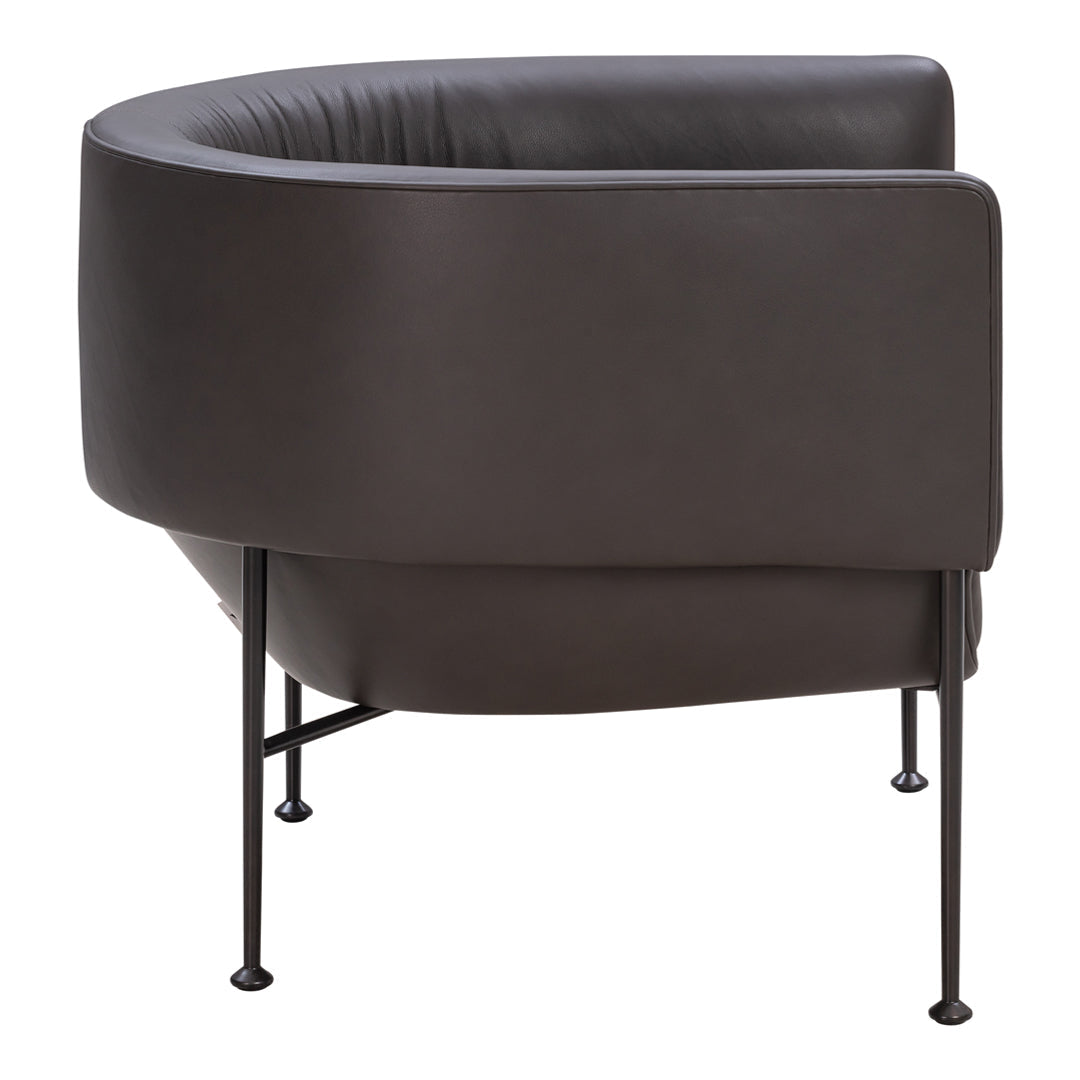 Dark brown leather lounge chair with a smooth, curved design and black metal legs. Modern and sleek aesthetic.