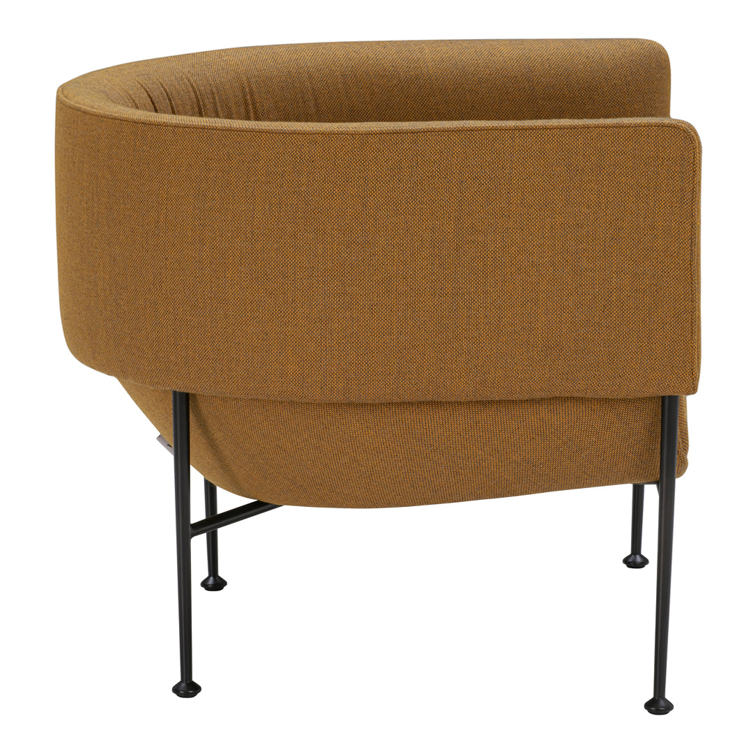 Curved armchair in warm mustard brown texture with minimalist black legs. Perfect for modern decor.