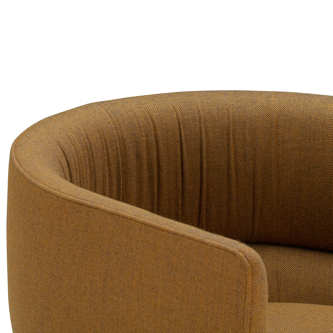 Brown upholstered armchair featuring vertical ribbed texture and a modern, curved design.
