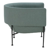 Curved chair in soft teal fabric with textured pattern, supported by sleek black metal legs.