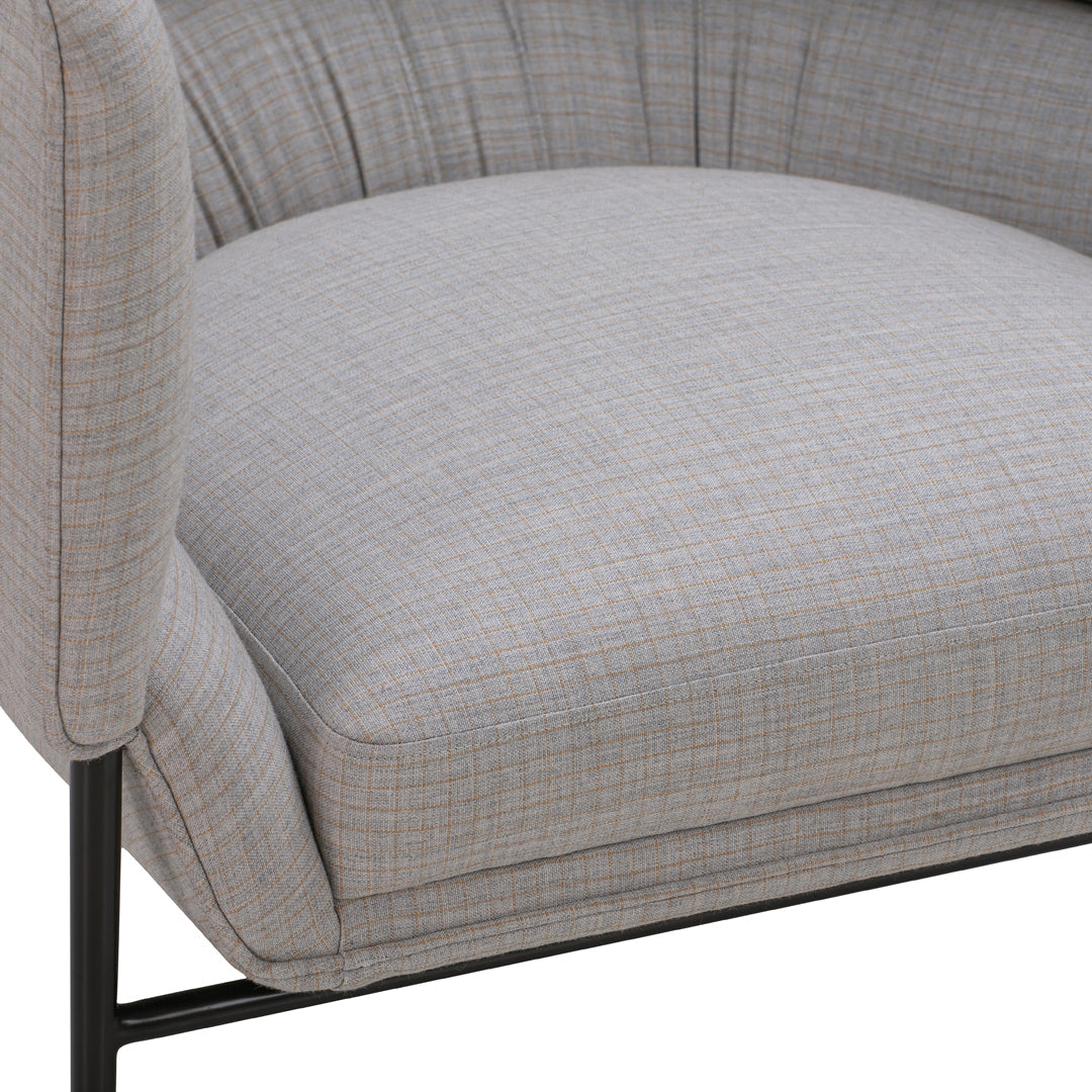 Light gray upholstered chair with a subtle checkered pattern and sleek black metal legs.