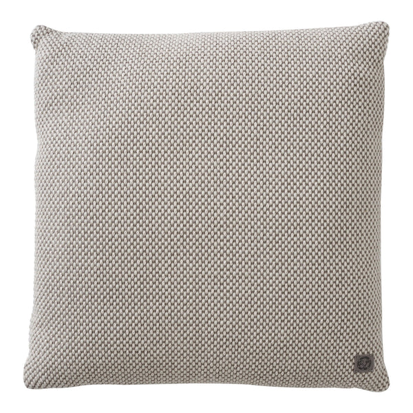 Square pillow with a neutral beige and cream checkered pattern, adding a cozy touch to any decor.