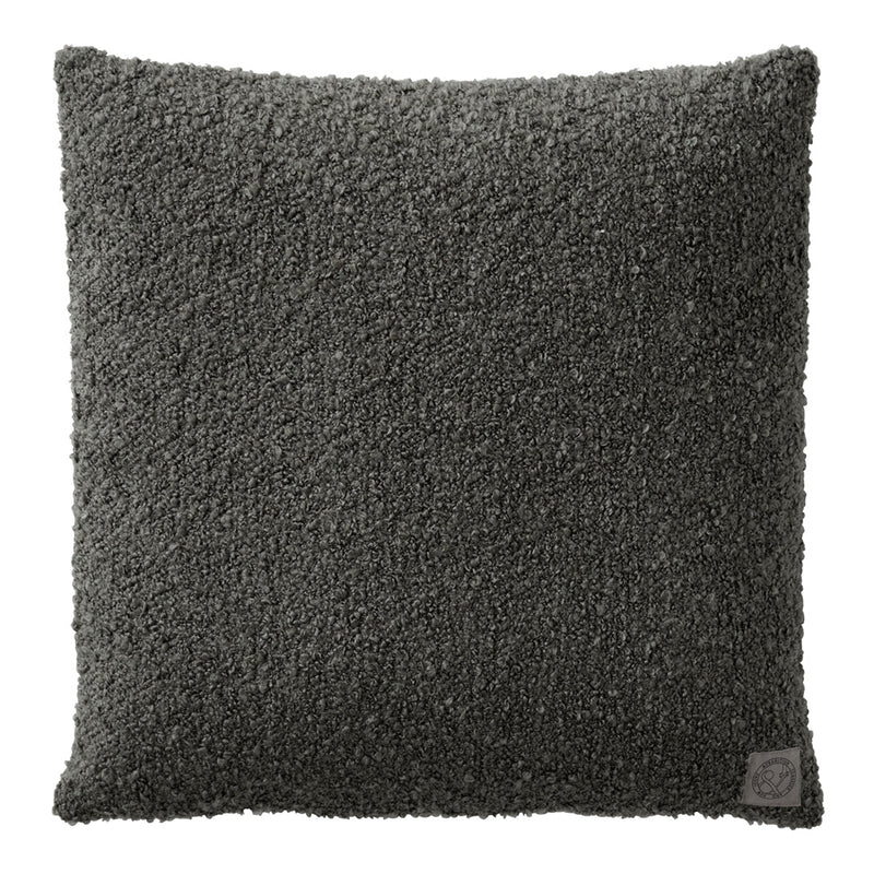 Textured dark gray throw pillow with a plush, fuzzy surface, ideal for modern interior decor.