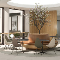 Modern seating in soft earth tones with a stylish wooden base and minimalistic design, accented by greenery.